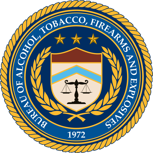 Blue and Gold Seal with scales in the middle for Bureau of Alcohol, Tobacco, Firearms and Explosives (ATF)