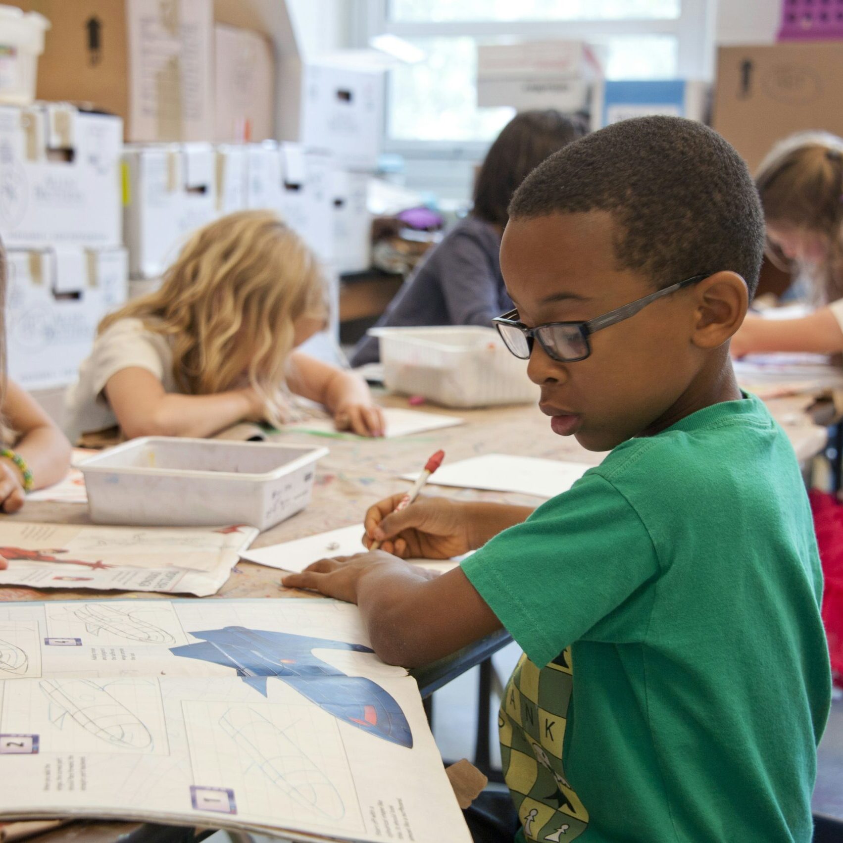 Education Option 1 small group of young children working independently at their desks in classroom