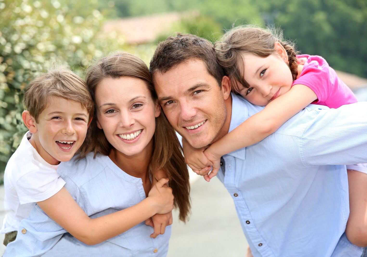 Portrait of happy family with young kids