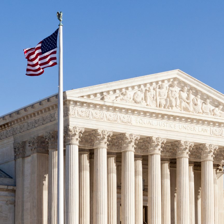 supreme court square outside photo of the Supreme Court, a large white marble building with a triangular pointed roof and large columns. an American flag flies to the left of the court.